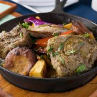 Pachamanca Tres Carnes · Chicken, beef and pork all slowly cooked with our Andean herbs sauce served with steam potat...