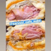 Sarussi Original Sandwich · Smoked ham, roasted pork leg, mozzarella cheese, pickles and house sauce. Sandwiches are pre...
