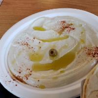 Hummus Plate · A smooth mix of mashed garbanzo beans, tahini, lemon, and garlic, with olive oil, served wit...