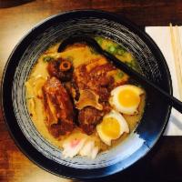 Oxtail Ramen · Miso based with chicken broth, oxtail, green onion, menma, fish cake, and soft boiled egg.