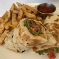 Asian Gyro Sandwich · House handmade scallion bread, lettuce, tomatoes, tender soy protein and fresh herbs with ra...