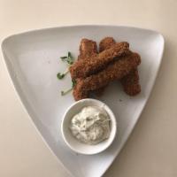 Crispy Wings · Crispy tender soy protein strips with spices and served with creamy house-made dressing.