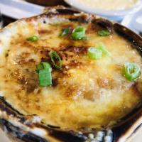 Crock of Ellie's French Onion Soup · Served with crouton and melted provolone cheese.