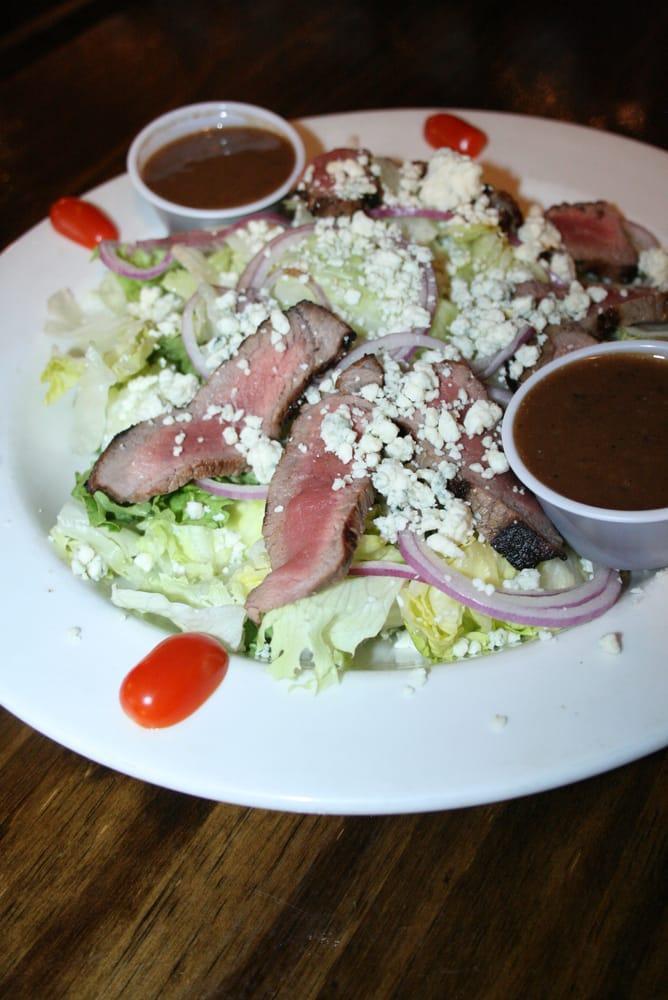 Black and Bleu Tenderloin Salad · Grilled petite beef tenderloin sliced and served over a bed of greens with sliced red onion, fresh grape tomatoes, pepperoncini and crumbled bleu cheese. We suggest a horseradish ranch dressing. Gluten friendly.