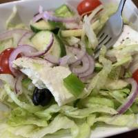 Greek Salad · Tomatoes, lettuce, cucumbers, olives, green peppers, red onions, feta, oregano, olive oil an...