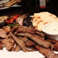 Combination Platter · Beef and pork platter with small Greek salad, tzatziki, pita bread and 1 side of your choice.