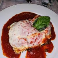 Lasagna · Thin pasta layered with bolognese meat ragu, 3 cheese blend tomato bechamel sauce. 