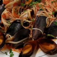 Pescatore · Mussels, clams and shrimp with white or red wine sauce.
