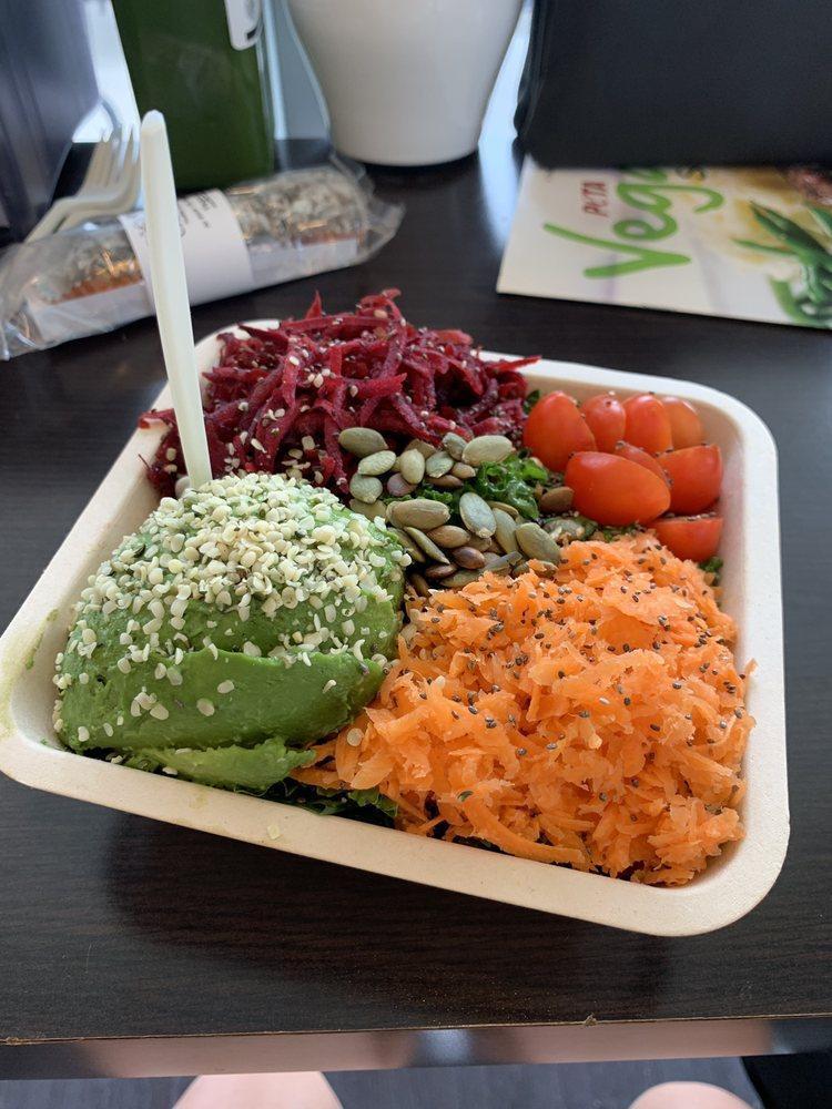 Superfood Salad · Kale, spinach, cucumber, celery, carrot, cherry tomato, beet, pumpkin seeds, cranberries, hemp seeds, chia seeds, and avocado. Served with avocado vinaigrette.