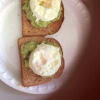 Avocado Toast · 2 whole wheat toast, homemade guacamole, 2 Sunny Side Up eggs.