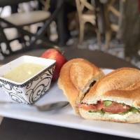 Smoked Salmon Sandwich · Avocado. cream cheese, lettuce and tomato. Served with a cup of soup and fresh fruit.