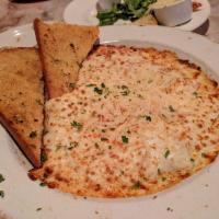 Baked Spaghetti · Baked spaghetti noodles in a special marinara sauce smothered with Parmesan, Swiss, feta and...