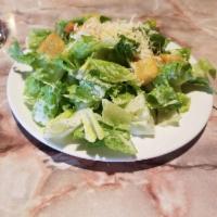Caesar Salad · Fresh romaine lettuce tossed with Caesar dressing, croutons with Parmesan cheese and a lemon...