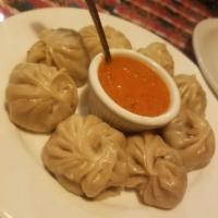 Chicken Momo · Steamed dumplings filled with ground chicken, onion, garlic, ginger, cilantro, and special s...
