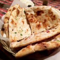 Bread Basket · Basket with plain, garlic, and onion naan.