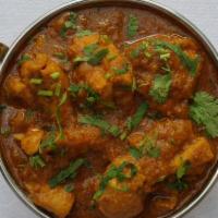 Chicken Curry · Boneless chicken prepared in a special curry sauce based on tomato and onion.