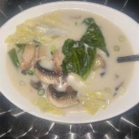 Coconut Soup · Coconut milk soup with Thai galangal, herbs and mushrooms.