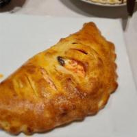Calzone · Pizza dough filled with fresh ricotta, mozzarella cheese, and herbs served with homemade mar...