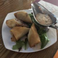 Reuben Spring Rolls · Stuffed with corned beef, Swiss cheese, and sauerkraut served with a Russian dipping sauce.