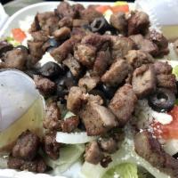 Gyro · Beef & Lamb meat combination, includes feta cheese, lettuce, tomato, onion and house dressing.
