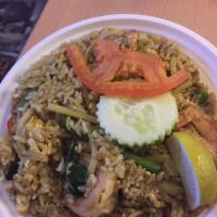 Green Curry Fried Rice · Basil, bell pepper, egg, garlic, long hot chili and onion. Spicy.