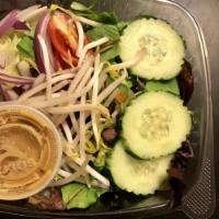 Thai Salad · Mixed green, carrot, cucumber, tomato, red onion and bean sprout with peanut sauce.