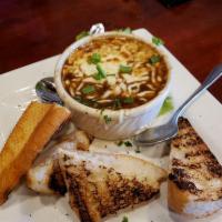 French Onion Soup · Sweet onion and red wine broth combined with house made croutons topped with provolone and m...