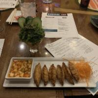 Gyoza · Ground pork, shrimp, mixed vegetables, soy vinaigrette.
