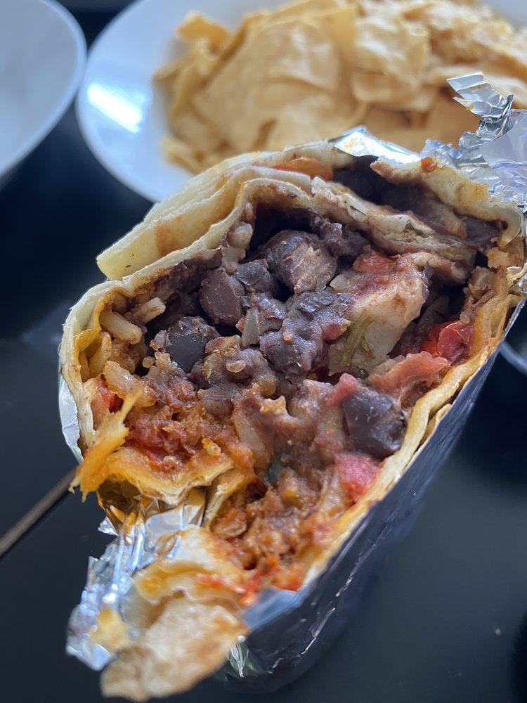 Soyrizo Burrito · Choice of beans, rice, pico de gallo, and tortilla or try it naked with lettuce. Comes with a single serving of papalote salsa and a few chips.