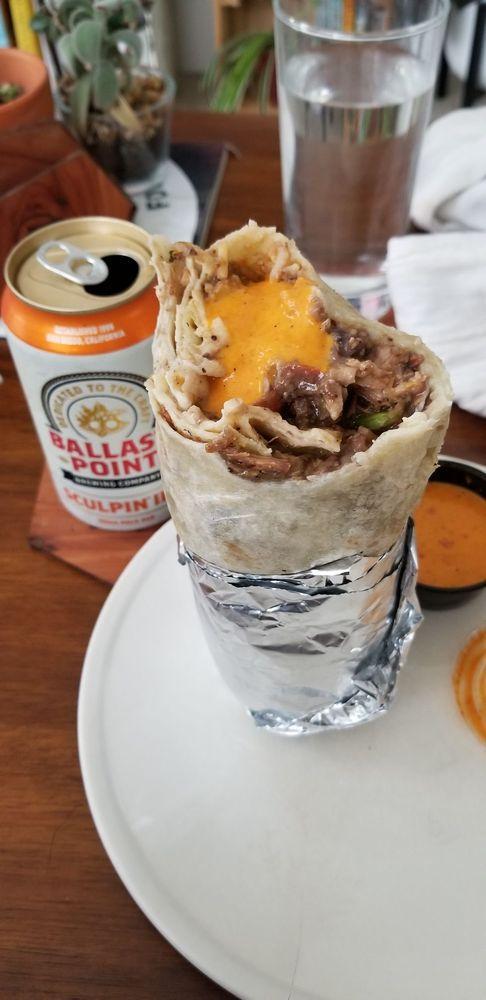 Chile Verde Burrito · Pork in green serrano sauce with choice of beans, rice, pico de gallo, and tortilla or try it naked with lettuce. Comes with a single serving of papalote salsa and a few chips.