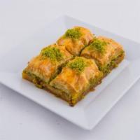 Baklava · Sweet pastry made of extremely thin sheets of phyloo dough layer with chopped nuts and honey...