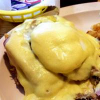 Eggs Benedict · 2 poached eggs, Canadian bacon on English muffin with Hollandaise sauce.