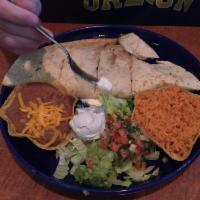Quesadilla · 2 flour tortillas stuffed with your choice of ground beef, chicken or picadillo, Jack and ch...
