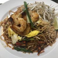 Pad Thai · Traditional, savory stir-fried thin rice noodles with egg, bean sprout, scallion, red tofu a...