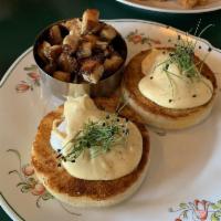 Eggs Benedict · Oven-roasted house-made pork porchetta served on 2 toasted English muffin halves each topped...