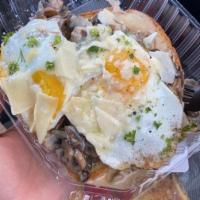 Mushroom Toast · Sauteed mushrooms, onions, roasted garlic, creme fraiche, topped with two fried eggs over bu...