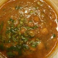 Daal Tadka · Pureed yellow lentils cooked with tomatoes, garlic and onion with a touch of fresh coriander.