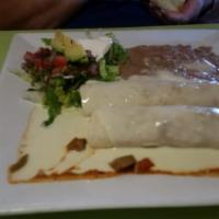 Chimichangas · Two flour tortillas, soft or deep-fried, filled with beef tips and re-fried beans. Topped wi...
