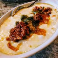Queso Fundido · Melted Chihuahua cheese mixed with homemade 