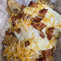 Crave Breakfast Bowl · Two eggs, chopped bacon or sausage, crave taters, and shredded cheese.
