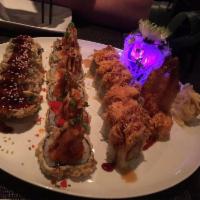 Angry Dragon Roll · Spicy tuna, shrimp tempura inside; topped with spicy king crab and kani in orange edamame sa...