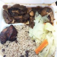 Oxtail · Served with fried plantains, veggies, and white rice or rice and peas. Spicy.