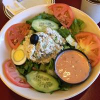 Tuna Salad · Mound of tuna salad on a bed of mixed greens with tomato, hard-boiled egg and cucumber. Serv...