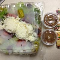 Greek Salad · Lettuce, tomato, onion, pepperoncini, feta cheese and Kalamata olives.