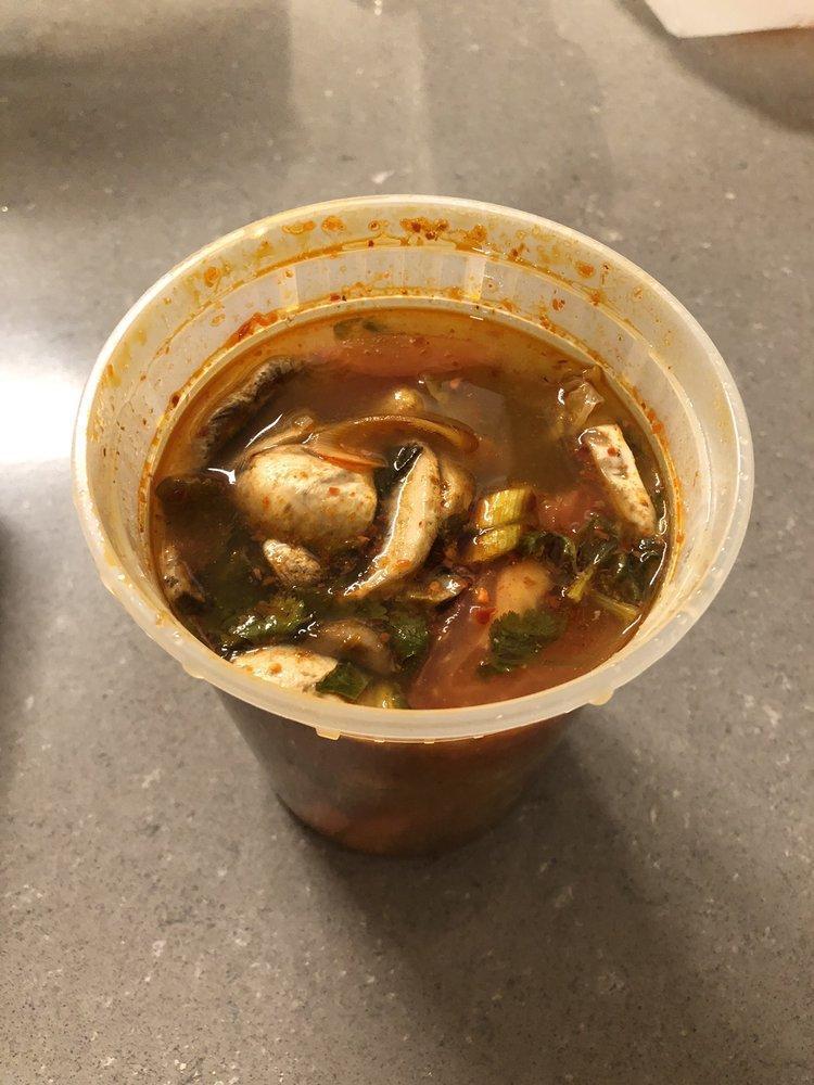 Tom Yum · Hot and sour soup with lemongrass, galangal, kaffir lime leaves, green onion, cilantro, mushrooms and tomatoes.
