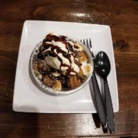 Churro Pie · Churro bites baked with marshmallows and your choice of raspberry, chocolate or caramel sauc...