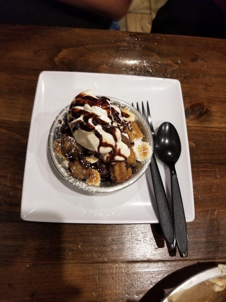 Churro Pie · Churro bites baked with marshmallows and your choice of raspberry, chocolate or caramel sauce. Served with a scoop of vanilla ice cream and whipped cream.
