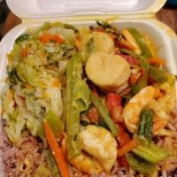 Coconut Curry Scallop and Shrimp · Jumbo shrimp and scallops sauteed in coconut curry sauce, fresh
veggies, herbs and spices c...