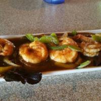 Jerk Shrimp · Spicy mouth watering jumbo shrimp simmered in onions, carrots,
peppers, tomatoes and fresh ...