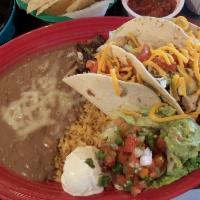 Tacos Supreme · 2 Beef tacos and 1 chicken fajita taco filled with lettuce, tomatoes and grated cheese, guac...